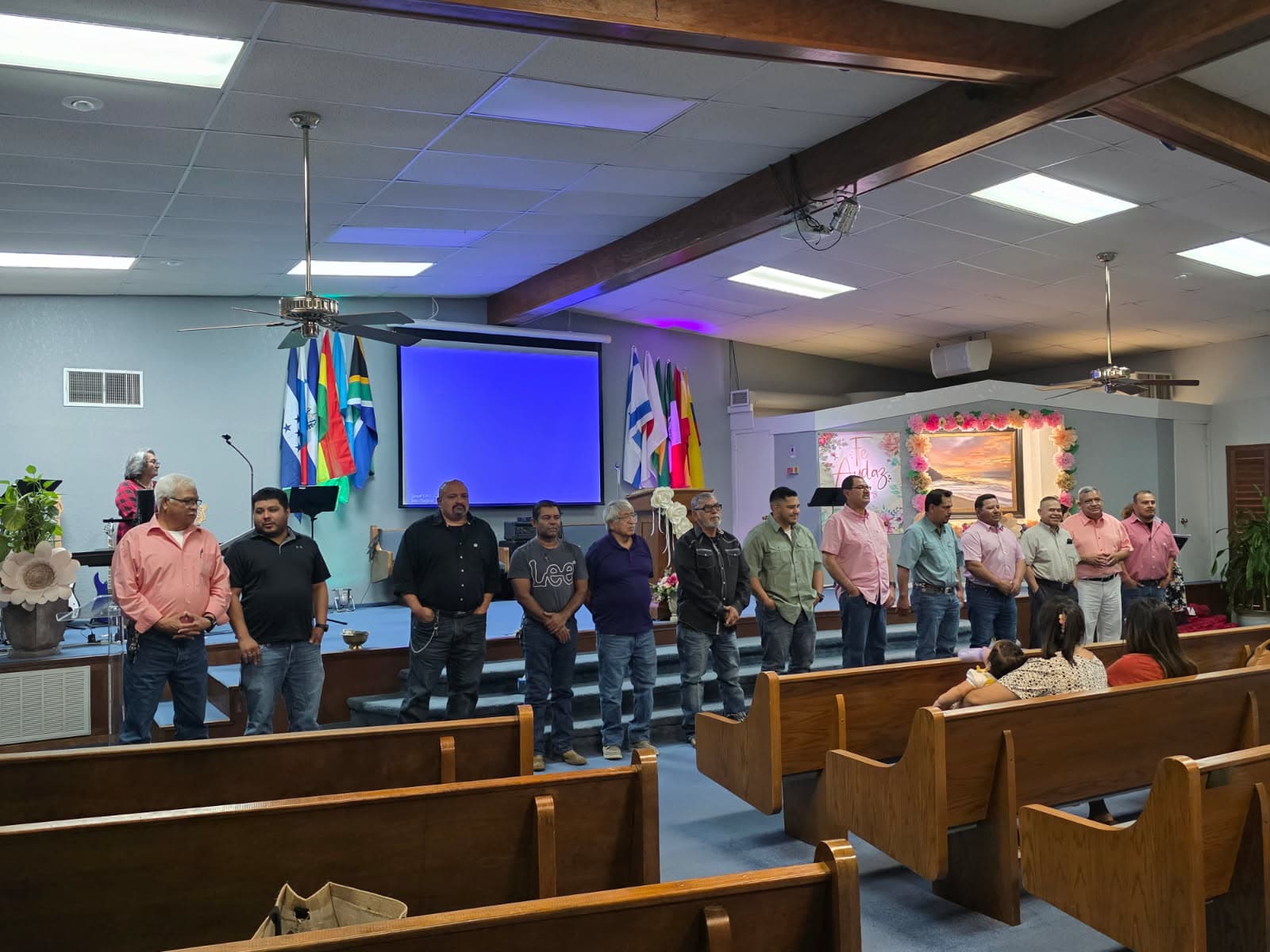 Men standing at the front of the Templo Siloe sanctuary.